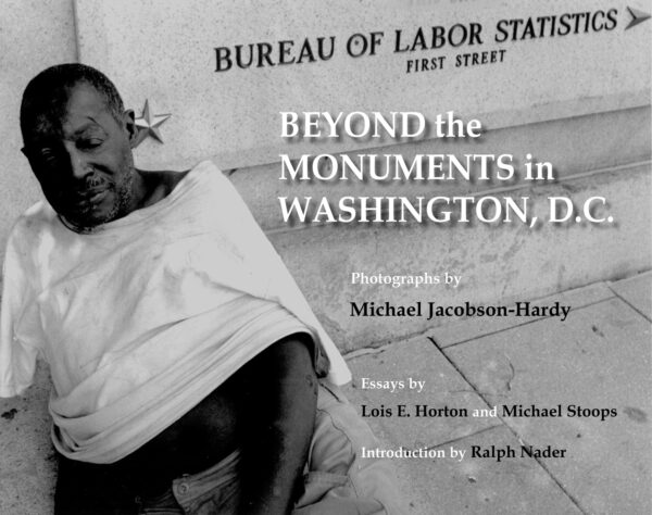 Front cover of BEYOND the MONUMENTS in WASHINGTON, D.C., showing black and white photograph of homeless man in front of the Bureau of Labor Statistics building. Photograph by Michael Jacobson-Hardy